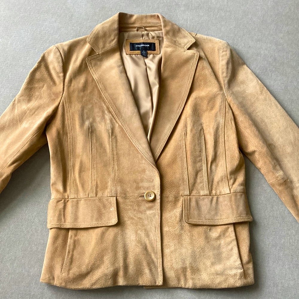 Tan leather jacket from Colebrook.